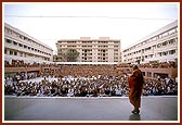 Swamishri gives darshan to the devotees seated in the upper open air assembly hall during the symbolic Jholi Sabha 