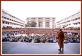 Swamishri gives darshan to the devotees seated in the upper open air assembly hall during the symbolic Jholi Sabha 