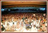 Devotees seated in the lower assembly hall for the symbolic Jholi sabha