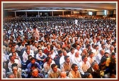 Devotees seated in the lower assembly hall for the symbolic Jholi sabha