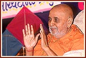 Swamishri blesses the devotees as they pass by for darshan