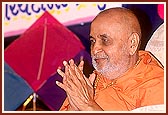Swamishri blesses the devotees as they pass by for darshan