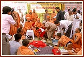Swamishri blesses the devotees participating in the shilanyas ceremony