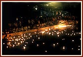 Over 5,000 divas float away into the distance on river Ghela