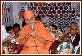 Swamishri blesses the devotees following the murti pratishtha ceremony
