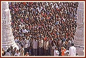 Thousands crowd around the main gateway for darshan of the newly consecrated murti of Shri Ghanshyam Maharaj