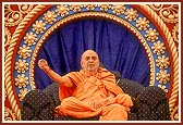 Swamishri blesses the devotees seated in the murti pratishtha assembly 