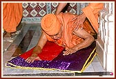 Swamishri prostrates to the murtis in the mandir