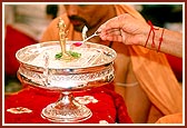Swamishri performs 'panchamrut snan' to Shri Harikrishna Maharaj