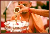 Swamishri performs 'panchamrut snan' to Shri Harikrishna Maharaj