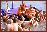 Senior sadhus offer abhishek to Swamishri