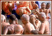 Senior sadhus offer abhishek to Swamishri