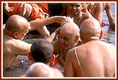 Senior sadhus offer abhishek to Swamishri