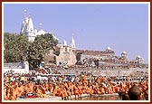 Sadhus and devotees watch from the banks as Swamishri and senior sadhus take a dip in the holy river