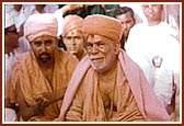 Yogiji Maharaj with Pramukh Swami Maharaj in the background