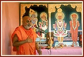 Swamishri blesses the devotees after the murti pratishtha ceremony