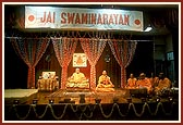 Swamishri on stage during the evening public assembly