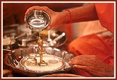 Swamishri offers panchamrut snan to Shri Harikrishna Maharaj