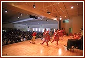 Balaks and kishores perform a welcome dance on stage