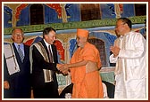 Swamishri blesses Hon. Phil Goff, Minister of Foreign Affairs and Trade and Minister of Justice and H.E. J Kipgen the High Commissioner for India (right)