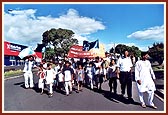 Young children carrying inspiring banners