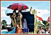 …sadhus singing devotional songs on the decorative peacock float with the murtis of Bhagwan Swaminarayan and Aksharbrahma Gunatitanand Swami