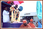…sadhus singing devotional songs on the decorative peacock float with the murtis of Bhagwan Swaminarayan and Aksharbrahma Gunatitanand Swami