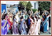 …women devotees joyfully dance with kalashes