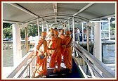 Swamishri boards the boat for the jal yatra
