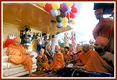 Sadhus sing devotional songs during the jal yatra
