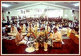 Brahmins recite the Vedic mantras during the murti pratishtha ceremony. Senior devotees are seated in the first row