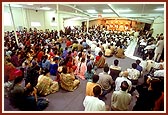 Devotees join in the murti pratishtha arti