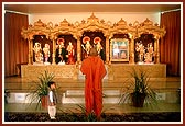 Swamishri engaged in Thakorji's darshan at the newly consecrated Shri Swaminarayan Mandir