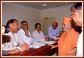 Swamishri blesses the devotees at the reception counter