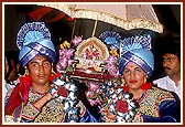 Kishores ceremoniously carry Thakorji on a decorated palanquin