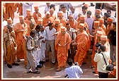 Swamishri being furnished with details of the construction