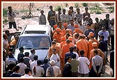 Swamishri observes the monument from his car