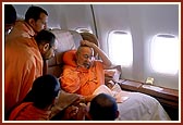 On the flight from Auckland to Singapore Swamishri discourses to the sadhus