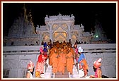 After Thakorji's darshan, Swamishri is welcomed by balaks while he descends the mandir steps