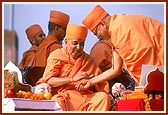... ties a nadachhadi on Pujya Ishwarcharan Swami's wrist