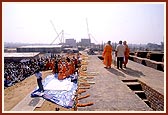 A view of rituals from plinth of mandir with Akshardham monument under construction in the background