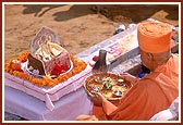 Swamishri performs arti of Thakorji on the first stone laid for the shikharbaddh mandir