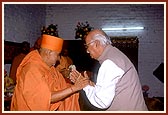 The Home Minister of India, Shri L. K. Advani, is welcomed by Swamishri during his visit to the Akshardham site