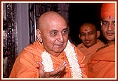 Swamishri is welcomed with a garland on his arrival to the mandir in Sarangpur