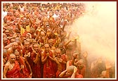 Swamishri then blesses all the sadhus with a shower of holy water