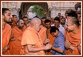 Suresh is overjoyed when Swamishri places a flower that he had offered into his pocket