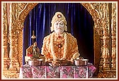 The sanctum of Yagnapurush Smruti Mandir with Annakut before the murti of Shastriji Maharaj