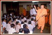 Swamishri showers flower petals on the balaks