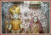 Shri Dharmadev and Bhaktimata adorned in chandan