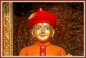 Shri Harikrishna Maharaj adorned and decorated in chandan for the hot summer day